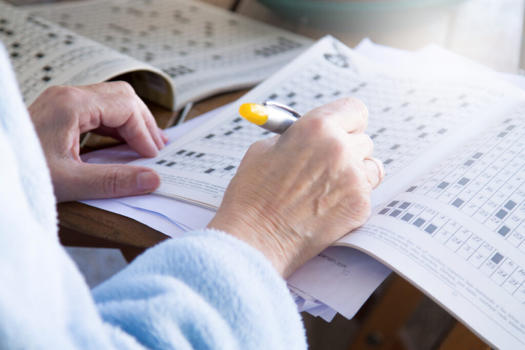 Senior Woman Doing Crossword Puzzle_Aden Senior Living