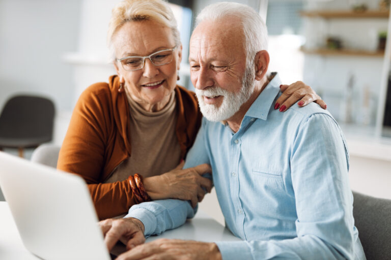 Senior Couple Looking at Computer_Catered Living